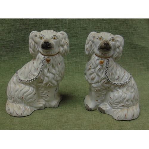 104 - Pair of late 19th century Staffordshire Spaniels.