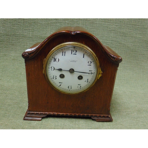 105 - Mahogany cased dome top mantle clock, 8 day movement striking on a gong, retailed by Butt & Co., Wre... 