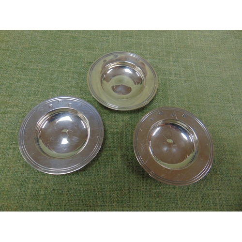 14 - Three circular silver pin trays, 3.25