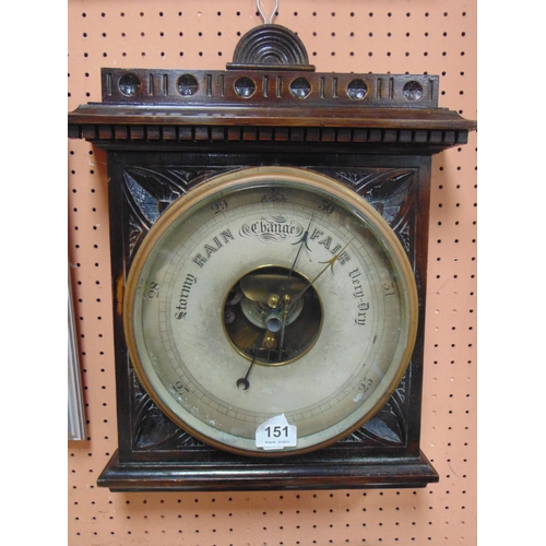 151 - Aneroid barometer in carved mahogany case.