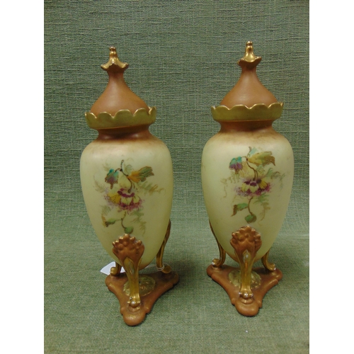 159 - Pair of continental blush ivory lidded vases (restored).