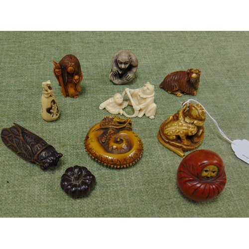 73 - Ten various antique carved wood / ivory netsuke. (10).