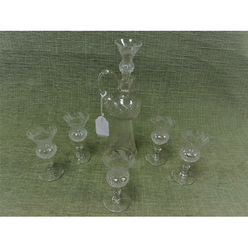 79 - Engraved cut glass six piece liqueur set.