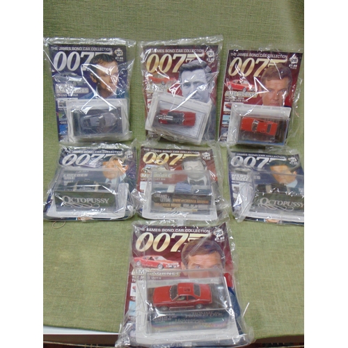 86 - Seven unopened scale model vehicles, The James Bond Car Collection.