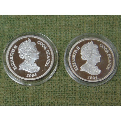 60 - Two silver proof One Dollar coins.