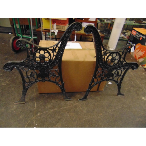 547 - Pair of cast iron bench ends.