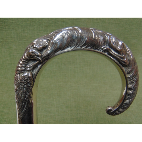 64 - A walking stick, the silver mounted handle modelled as a Fox holding a Pheasant in his mouth.