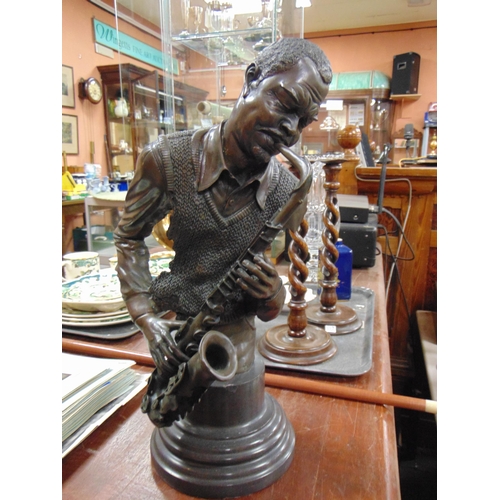 66 - Modern Bronze style bust, modelled as a saxophone player. 16.5