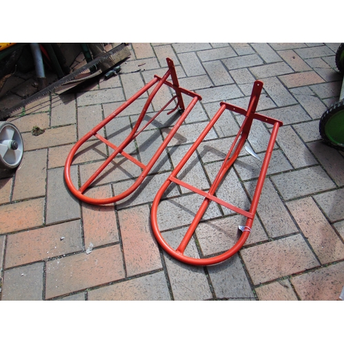 504 - Pair of red coloured saddle racks.