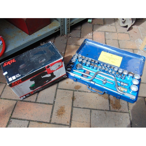 510 - Boxed Skil electric planer and a cased socket set , (2).