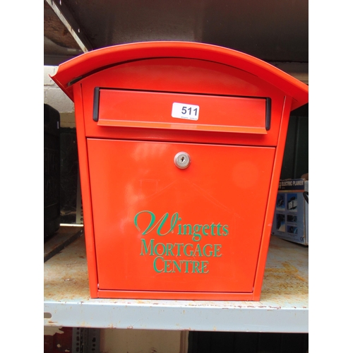 511 - Red coloured wall mounted post box.