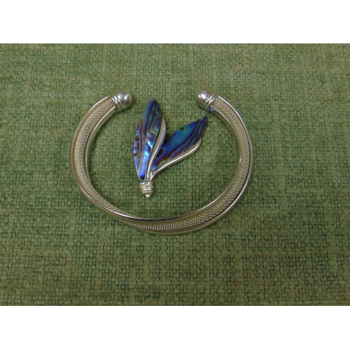 49 - Silver and enamel brooch, together with a Sterling Silver bangle. (2).