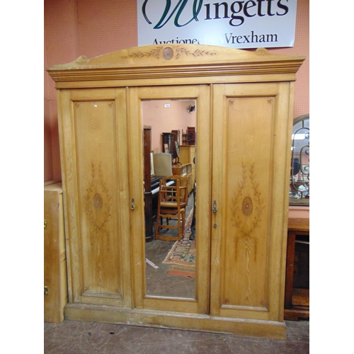 433 - 19th century Ash triple wardrobe, ogive cornice above centre mirror door, flanked by further doors e... 