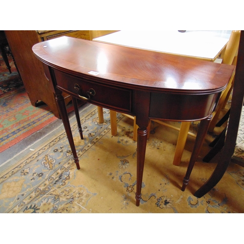 374 - Reproduction inlaid mahogany demi lune hall table, single drawer and on turned supports. 30 x 35 x 1... 