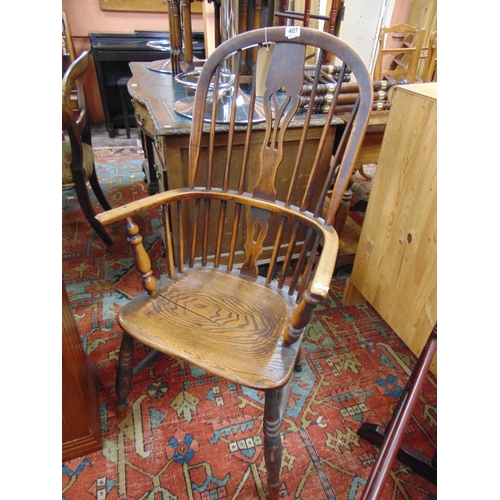 407 - Antique elm Windsor chair, pierced splat back, open arms, solid seat, on turned supports and stretch... 