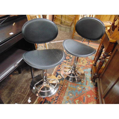 408 - Pair of contemporary rise and fall high backed stools.