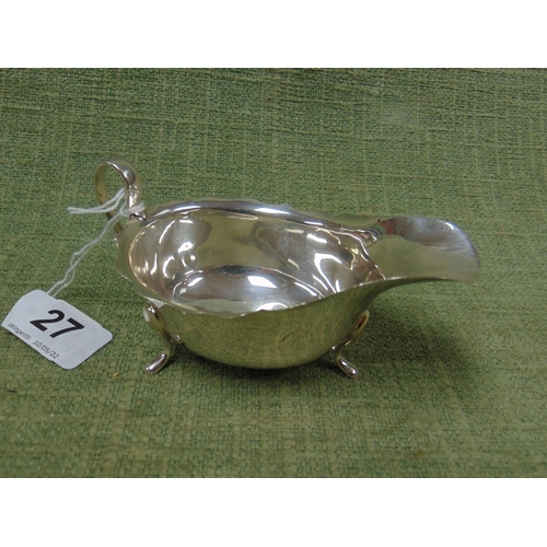 27 - Silver sauce boat, having shaped handle and on pad feet. Birmingham 1928. 1.6 onz .