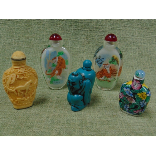 16 - Five reproduction oriental scent bottles.