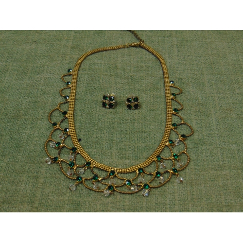 19 - Cased fine ladies necklace and earrings, set with green and clear glass stones.