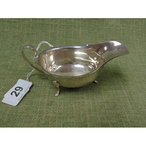 29 - Silver sauce boat, shaped handle and on pad feet, Birmingham 1962, 1.6 onz.