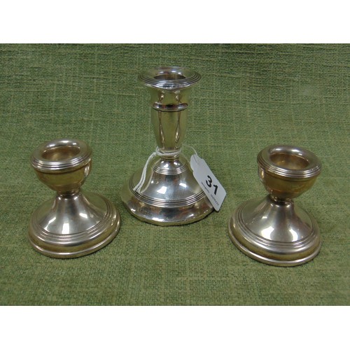 31 - Pair of silver squat candlesticks, Birmingham 1977, together with another silver candle holder, Birm... 