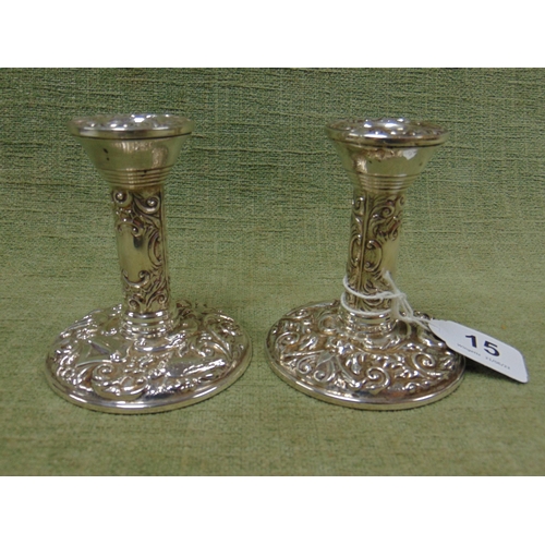 15 - Pair of modern silver candlesticks with embossed decoration, 4