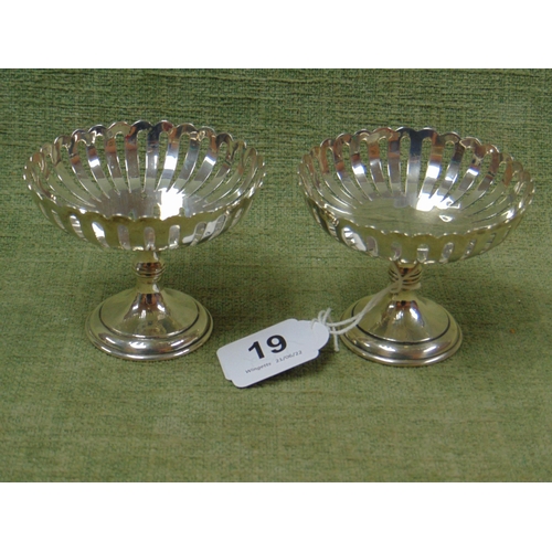 19 - Pair of circular silver footed bowls with pierced sides, 3.5