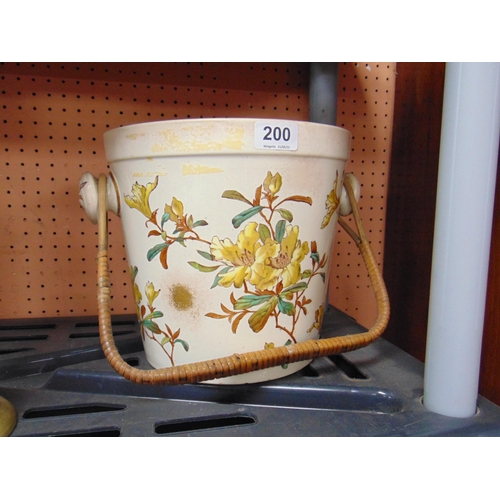 200 - Victorian toilet pale, having wicker handle and floral decoration.