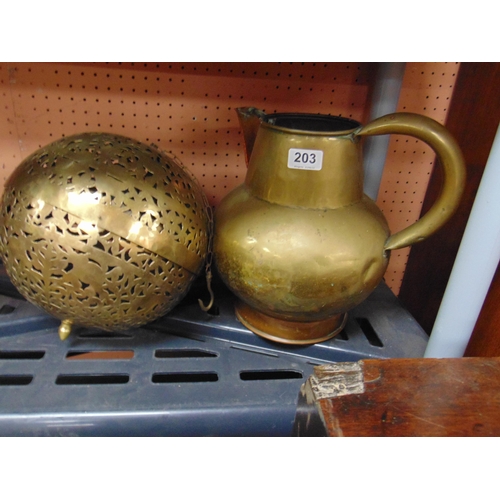 203 - A brass jug, together with a circular incense ball (2).