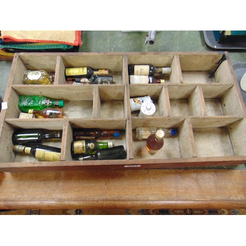 264 - Small quantity of miniature spirits, contained in a pine case.