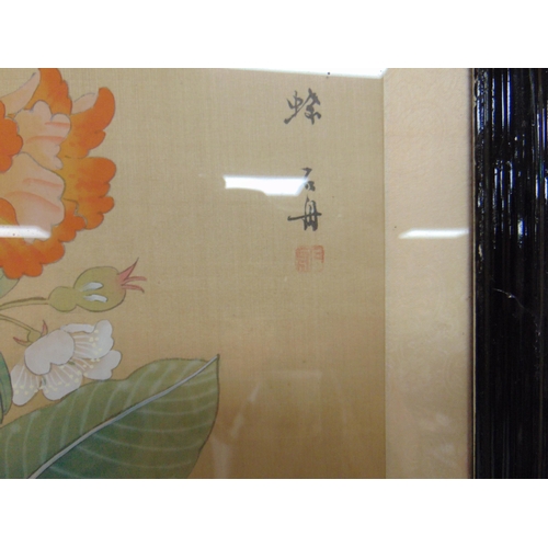 275 - Pair of framed and glazed Oriental prints on silk, each 21 x 10