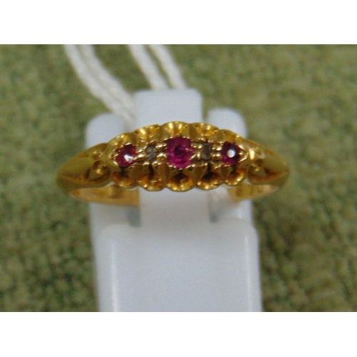 34 - 18ct gold ruby three stone diamond ring, size P, 3.5g.