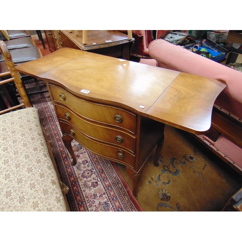 375 - Reproduction drop leaf serpentine form chest of three drawers, set on shell knee cabriole supports. ... 