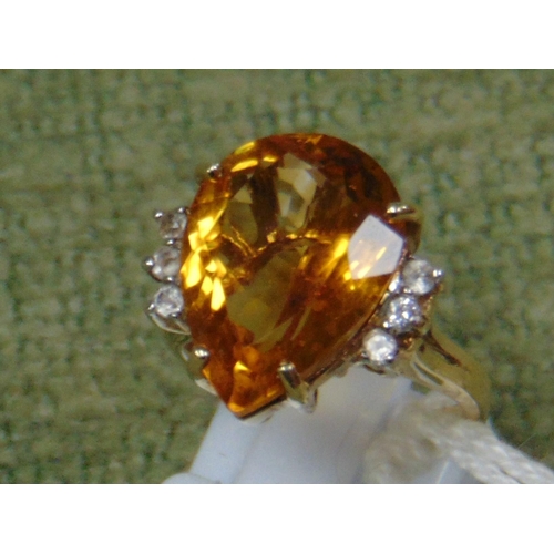 58 - 9ct gold ring set with a large pear cut orange stone, size K, 5g.