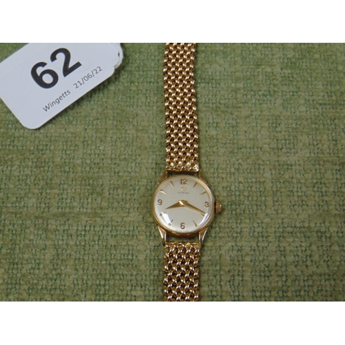 62 - Omega ladies 9ct gold cased wristwatch, manual wind, on heavy 9ct gold flexible bracelet, 30g.