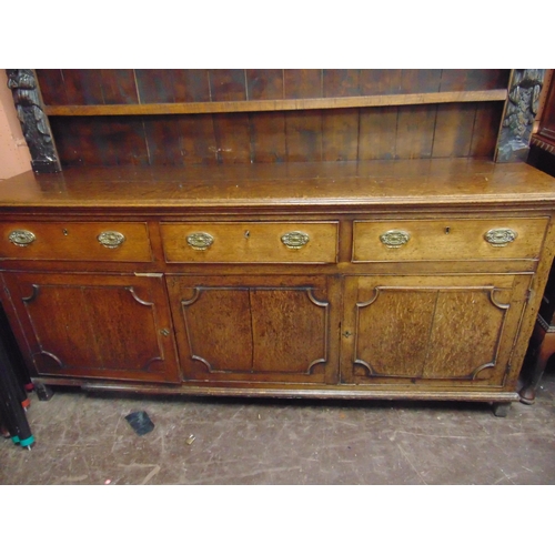 352 - Antique oak dresser, associated plate rack back having shelf lined centre, the base with three drawe... 