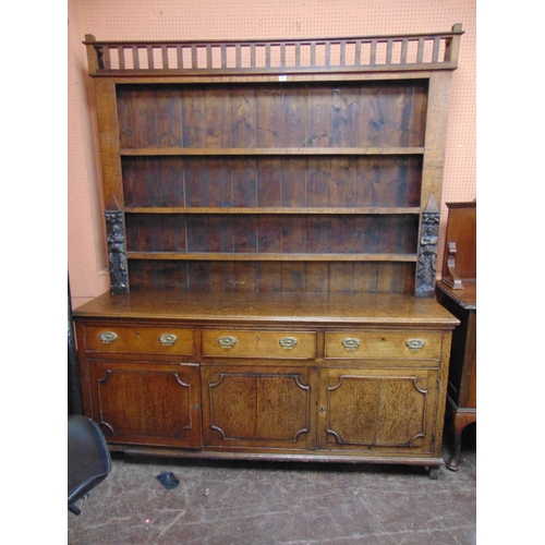 352 - Antique oak dresser, associated plate rack back having shelf lined centre, the base with three drawe... 