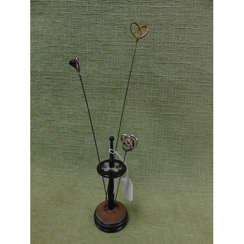 123 - Silver mounted ebony hatpin stand, with three hatpins.