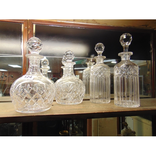 124 - Two pairs of circular cut glass decanters.