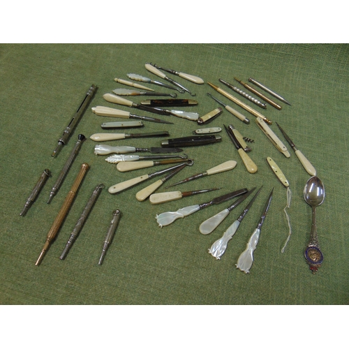 131 - Miniature penknives, mother of pearl handled manicure accessories etc.