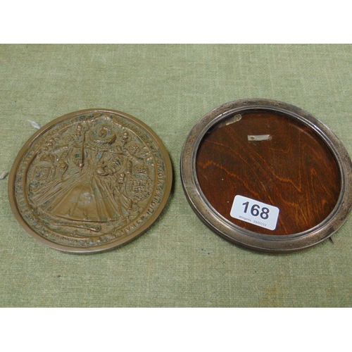 168 - Circular silver photograph frame and a circular moulded plaque.