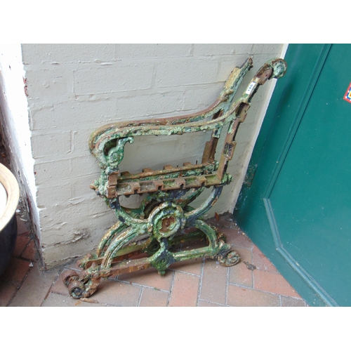 186 - Pair of cast iron bench ends, each 32 x 26