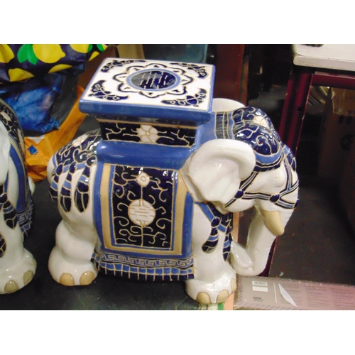 23 - Pair of reproduction ceramic elephant conservatory seats.