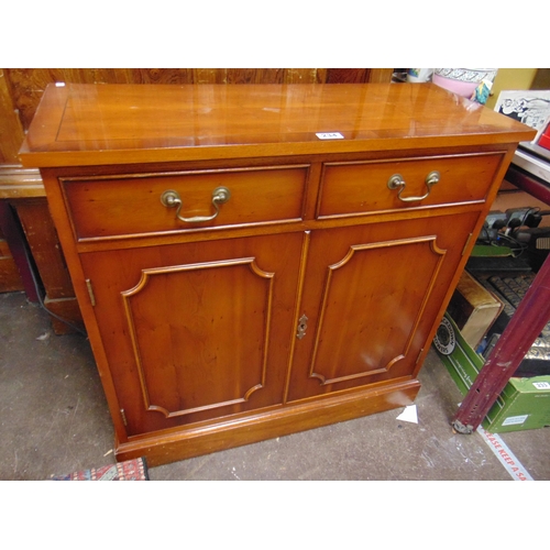 234 - Reproduction Yew wood side cabinet, pair of short drawers, two cupboard doors and on platform base. ... 