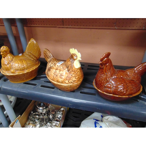 272 - Three pottery Hens on nests.