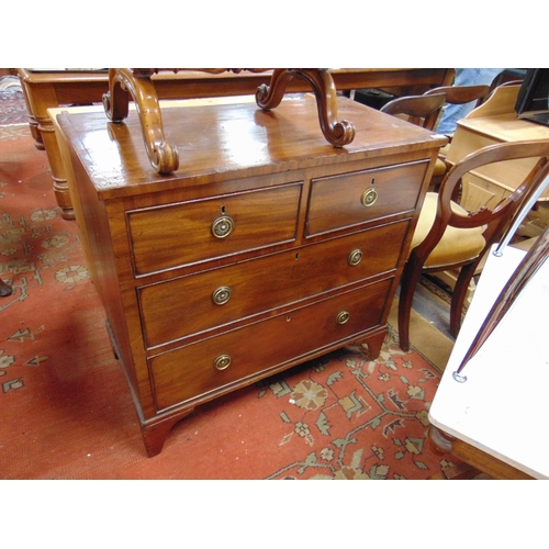 299 - Antique mahogany chest of two short and two long drawers with ring handles and on bracket feet. 34 x... 