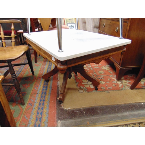 310 - Aesthetic influenced marble topped centre table, set on quatre form base. 21 x 32 x 24