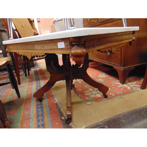 310 - Aesthetic influenced marble topped centre table, set on quatre form base. 21 x 32 x 24