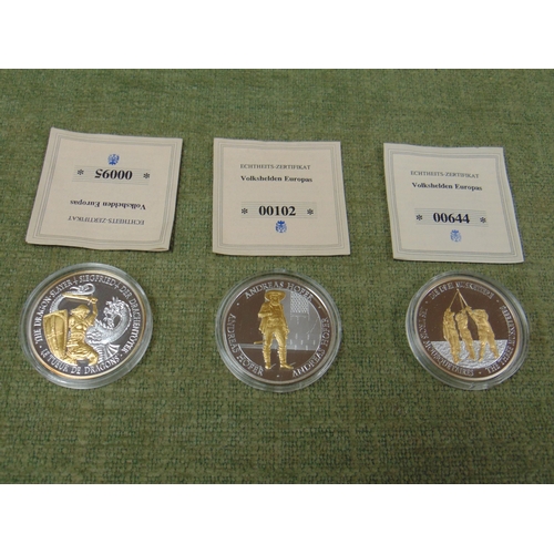 32 - Three gold plated commemorative coins with certificates.