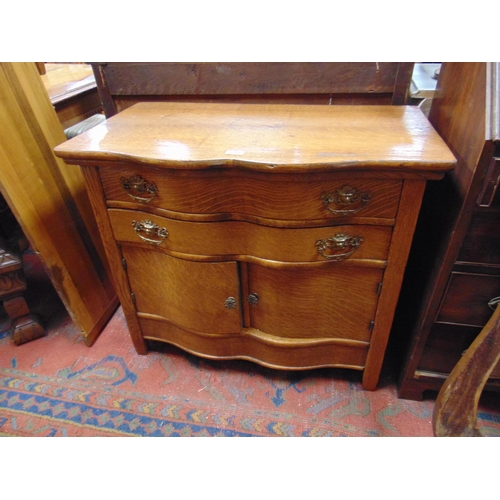 335 - Continental oak bedroom suite, comprising mirror back dressing chest and smaller chest.